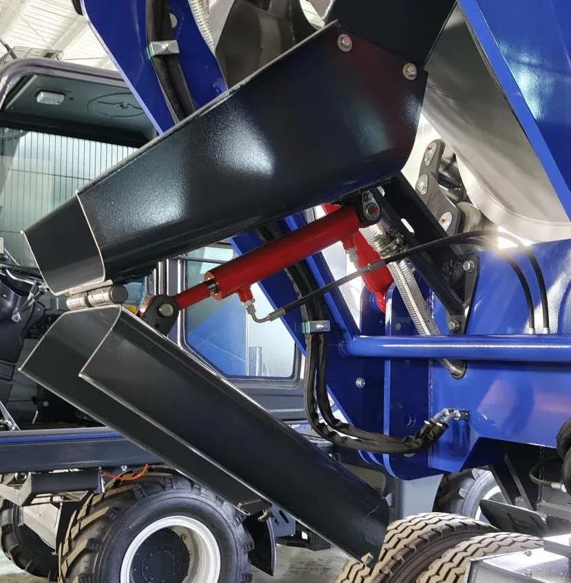 Extending Discharge Chute on Self-Loading Concrete Mixers