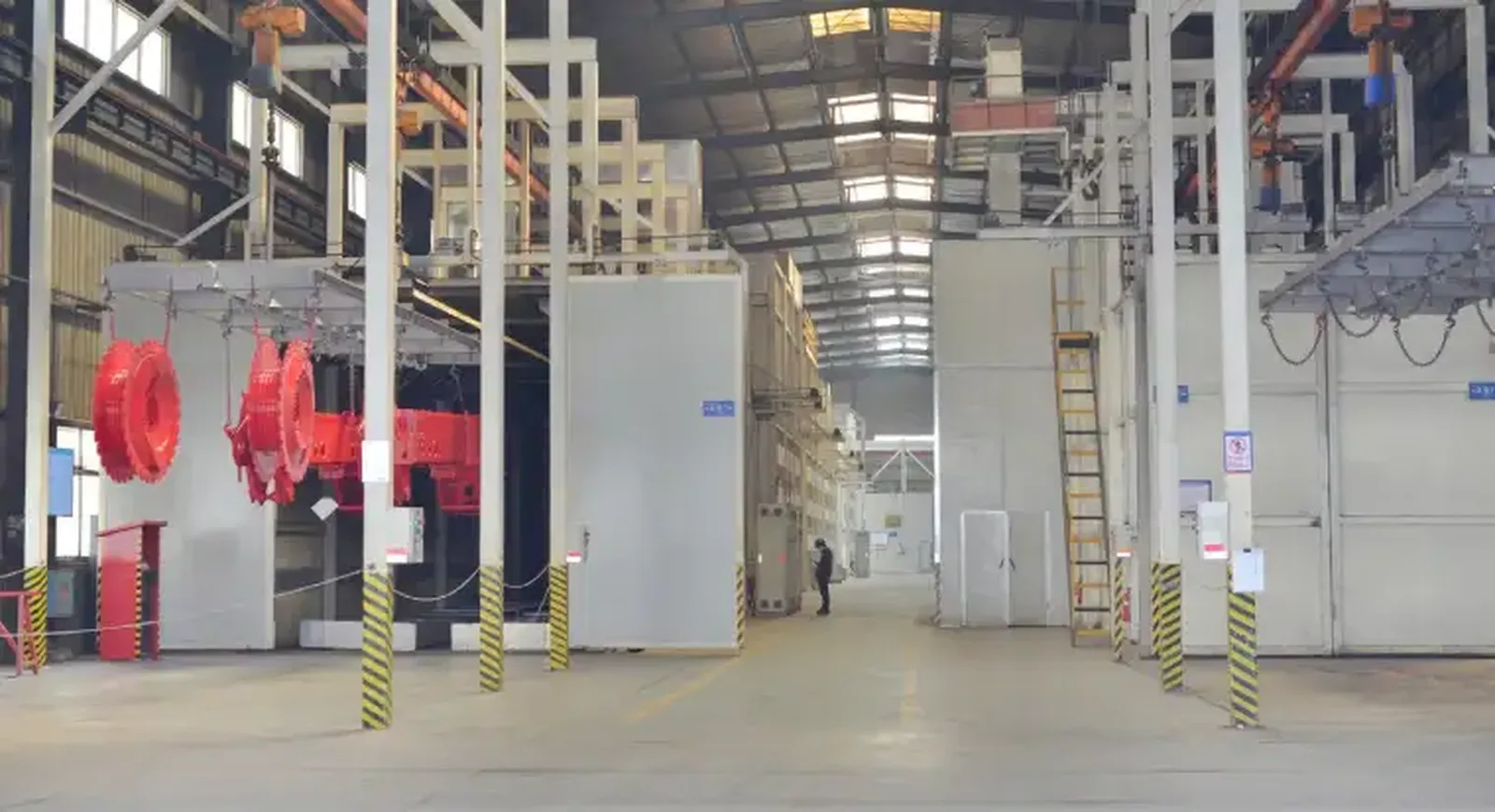 Steel machinery component receiving protective surface treatment during contract manufacturing