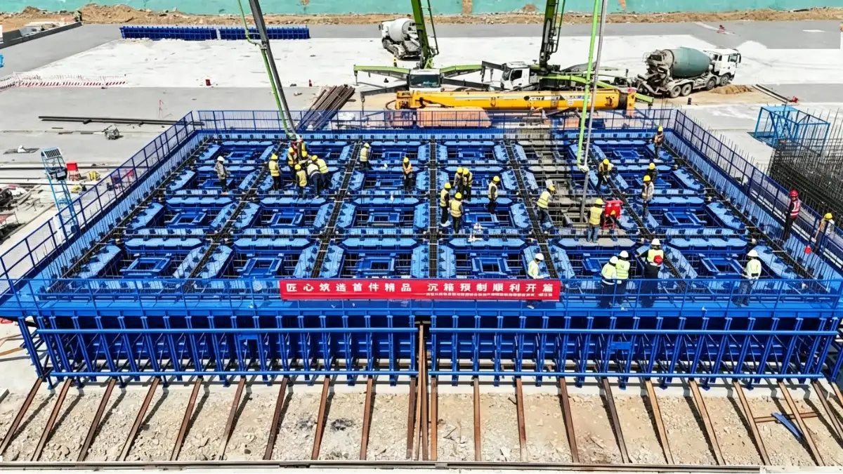 Large blue modular caisson formwork with internal cells prepared for concrete placement