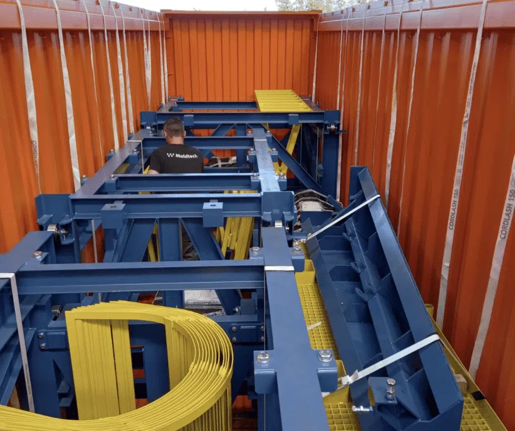 Steel mould equipment secured inside a shipping container
