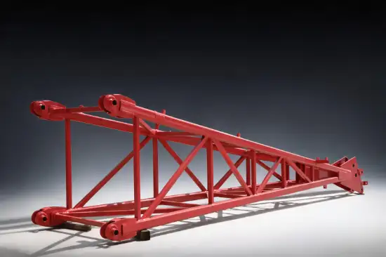 Red lattice crane boom head manufactured as a welded construction machinery component