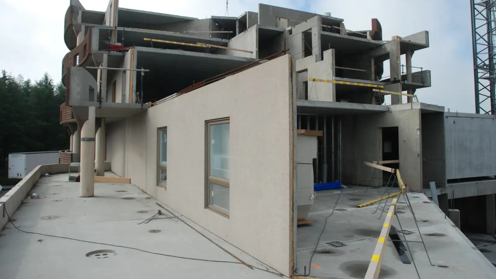 Precast wall panel with window openings and cast-in items