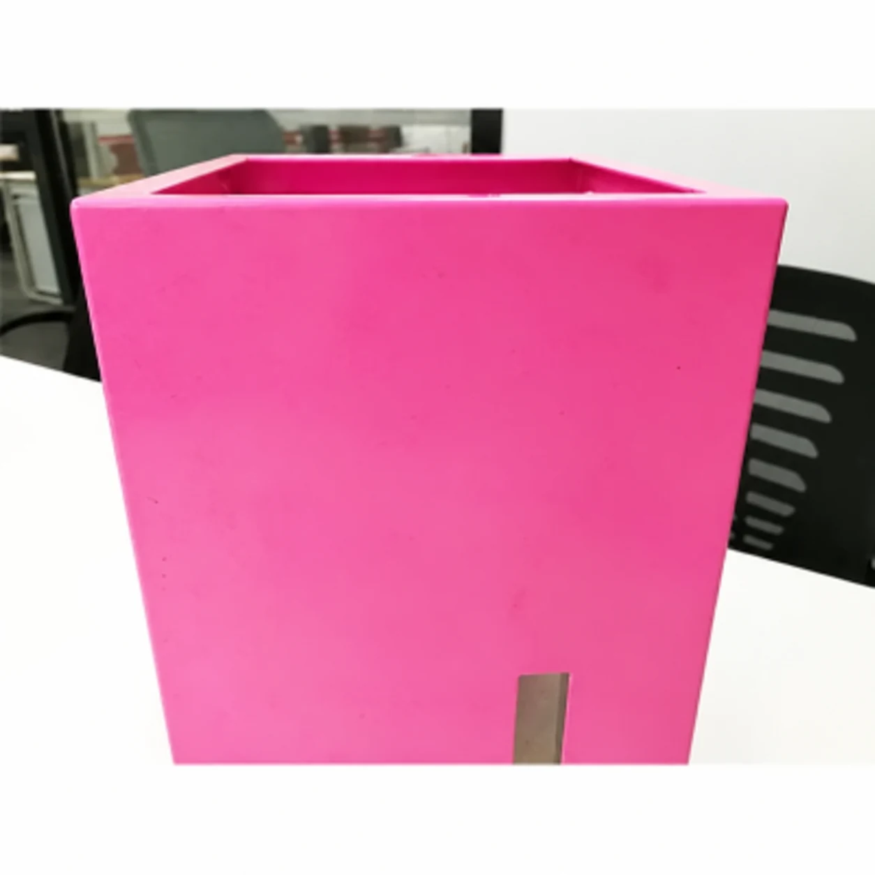 Unbranded pink finished open-top sheet metal housing with a lower rectangular slot